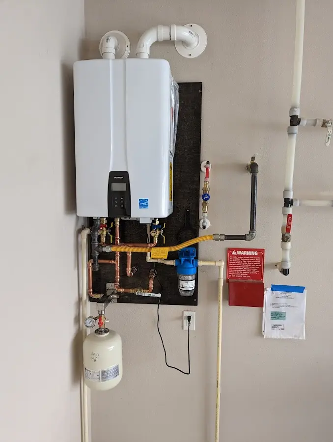 Professional plumber installing copper piping in a Canyon Lake home